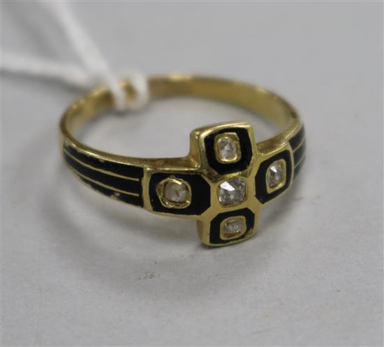 A Victorian yellow metal, black enamel and diamond set mourning ring, size P.